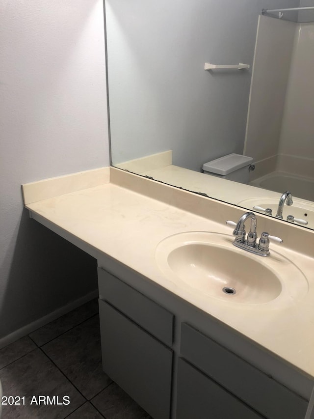 4042 E Carson Rd, Phoenix, AZ 85042 - bathroom featuring tile patterned floors, vanity, and bathing tub / shower combination