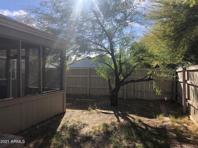 4042 E Carson Rd, Phoenix, AZ 85042 - fenced backyard featuring a sunroom