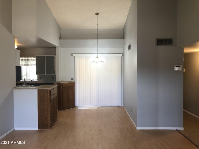 4042 E Carson Rd, Phoenix, AZ 85042 - kitchen featuring light wood-style floors and baseboards