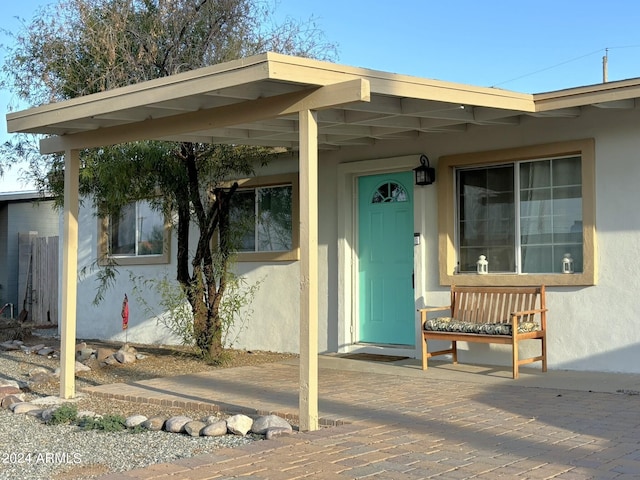 entrance to property with a patio