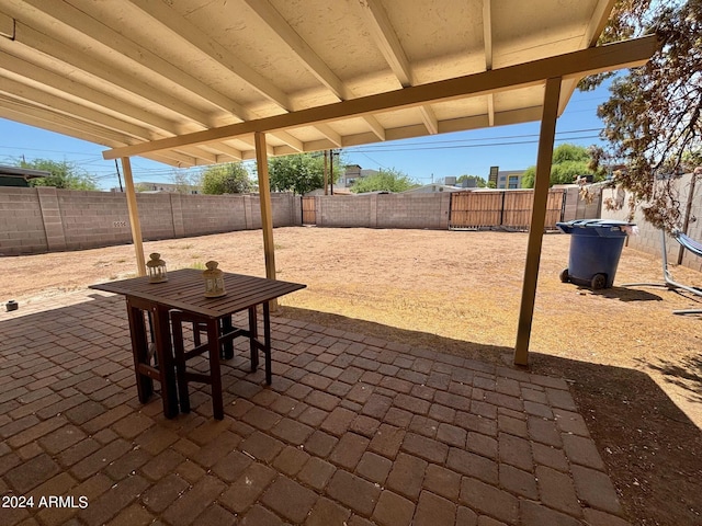 view of patio featuring outdoor dining space and a fenced backyard