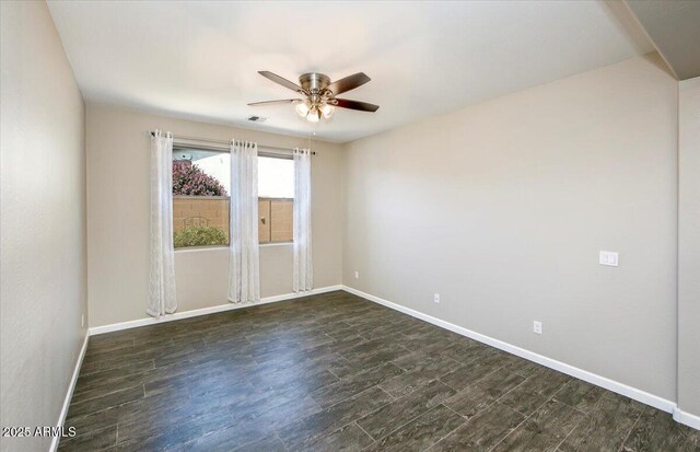 7769 E Lavender Loop, Prescott Valley, AZ 86315 - unfurnished room with a ceiling fan, baseboards, and dark wood finished floors