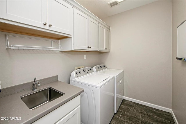 7769 E Lavender Loop, Prescott Valley, AZ 86315 - laundry area with cabinet space, washing machine and dryer, baseboards, and dark wood-style floors