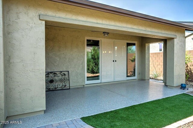 7769 E Lavender Loop, Prescott Valley, AZ 86315 - doorway to property featuring a patio and stucco siding