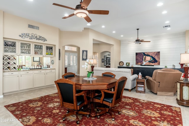 tiled dining area featuring ceiling fan