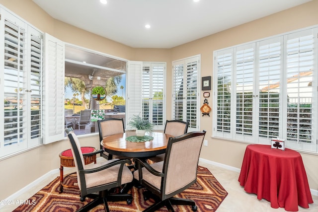 dining area with plenty of natural light and light tile patterned floors