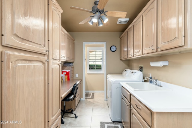 clothes washing area with washing machine and clothes dryer, ceiling fan, sink, cabinets, and light tile patterned floors