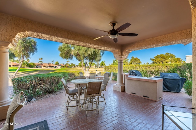 view of patio / terrace with ceiling fan and area for grilling