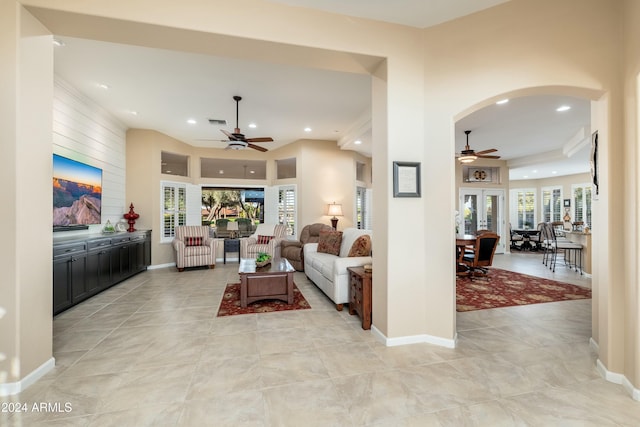 living room with plenty of natural light and ceiling fan