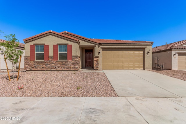 view of front of property featuring stucco siding, an attached garage, stone siding, and concrete driveway