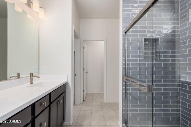 bathroom featuring vanity, tile patterned flooring, and a shower stall