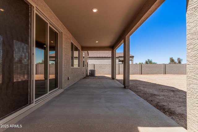 view of patio / terrace featuring central air condition unit and a fenced backyard