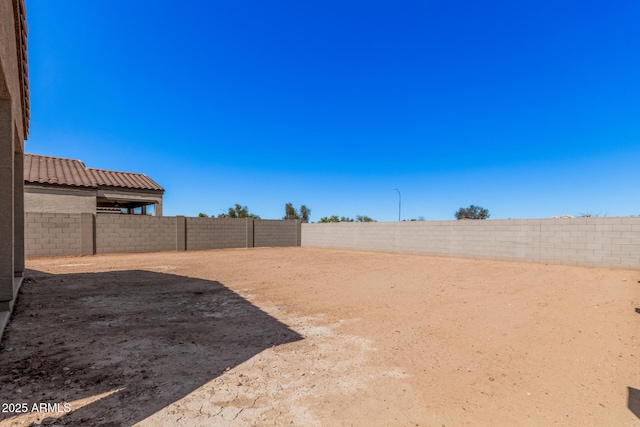 view of yard featuring a fenced backyard
