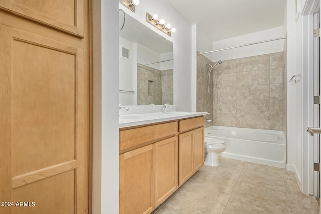 full bathroom with oversized vanity, tiled shower / bath, toilet, and tile floors