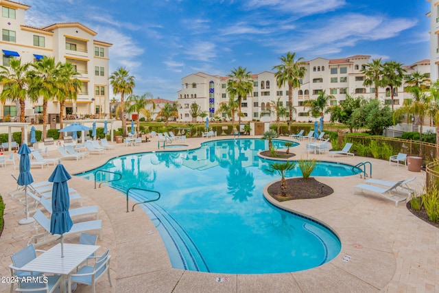 view of swimming pool with a patio area