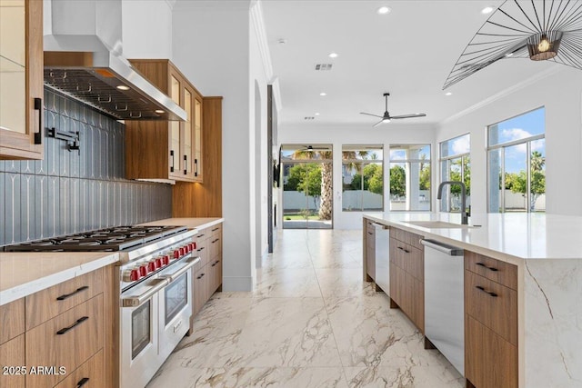 3354 E Jaeger Cir, Mesa, AZ 85213 - kitchen featuring range with two ovens, wall chimney range hood, crown molding, recessed lighting, and plenty of natural light