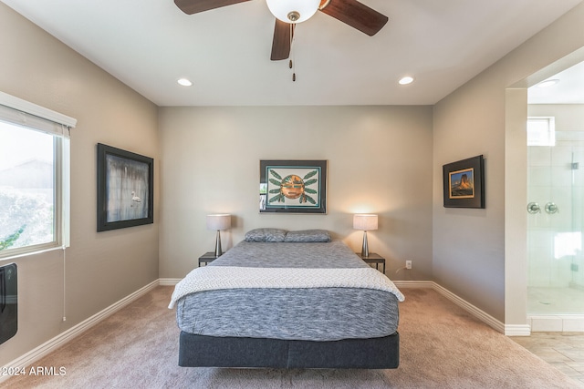 carpeted bedroom featuring ceiling fan and connected bathroom