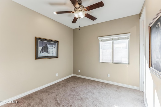 unfurnished room with light carpet and ceiling fan