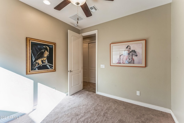 interior space featuring ceiling fan