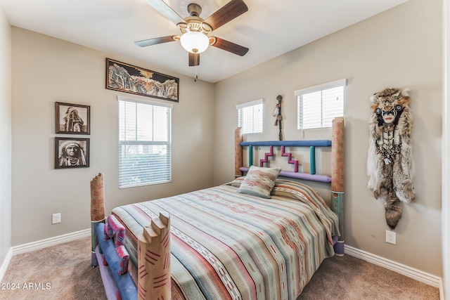 bedroom with ceiling fan and carpet floors