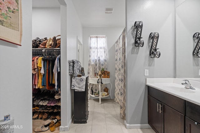 bathroom with vanity and tile patterned flooring