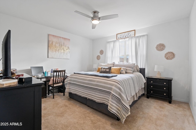 bedroom featuring ceiling fan and light carpet