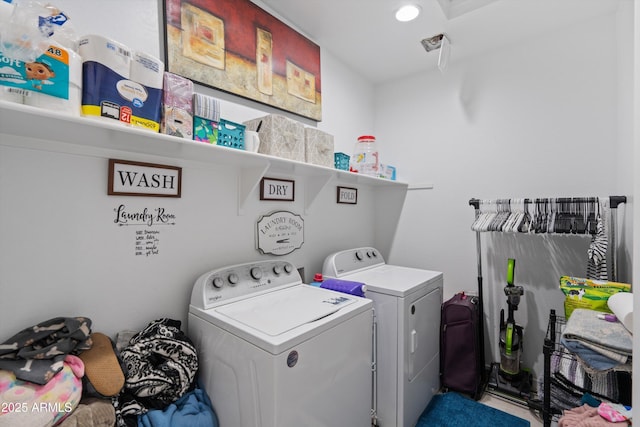 clothes washing area featuring washing machine and clothes dryer