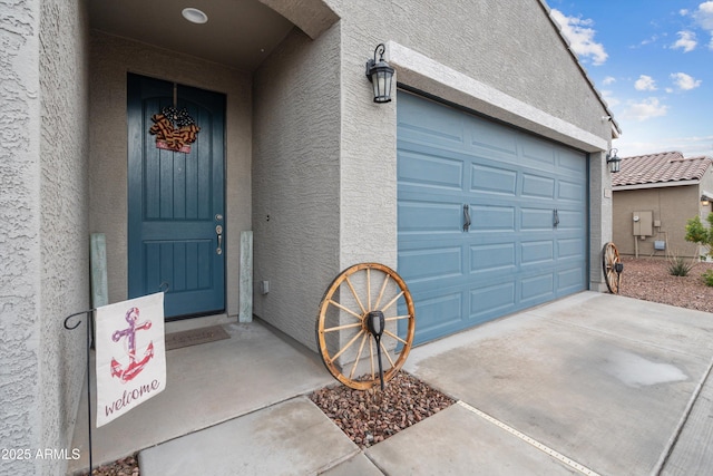 entrance to property featuring a garage