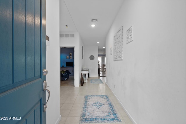 hallway with light tile patterned floors