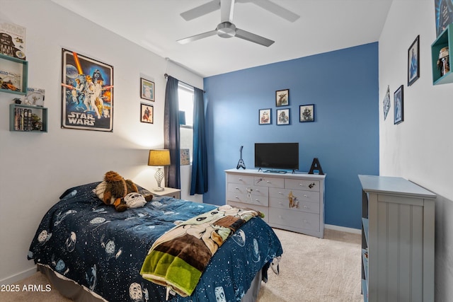 bedroom featuring light colored carpet and ceiling fan