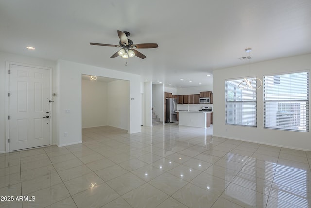 3451 S Wren Dr, Gilbert, AZ 85297 - unfurnished living room with light tile patterned floors, a ceiling fan, recessed lighting, and a chandelier