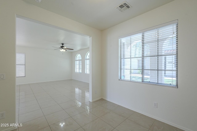 3451 S Wren Dr, Gilbert, AZ 85297 - spare room featuring a ceiling fan and light tile patterned floors