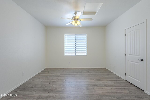 3451 S Wren Dr, Gilbert, AZ 85297 - empty room with wood finished floors and a ceiling fan