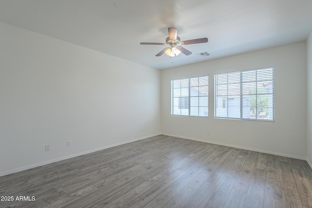 3451 S Wren Dr, Gilbert, AZ 85297 - spare room featuring ceiling fan and wood finished floors