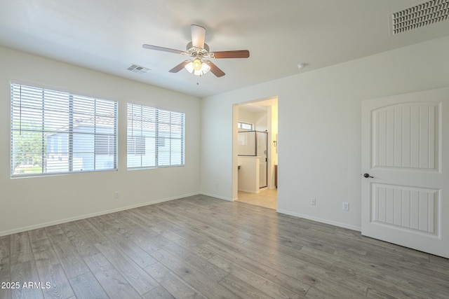 3451 S Wren Dr, Gilbert, AZ 85297 - spare room featuring a ceiling fan, wood finished floors, and a smoke detector