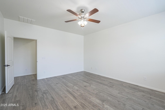 3451 S Wren Dr, Gilbert, AZ 85297 - spare room featuring wood finished floors and ceiling fan