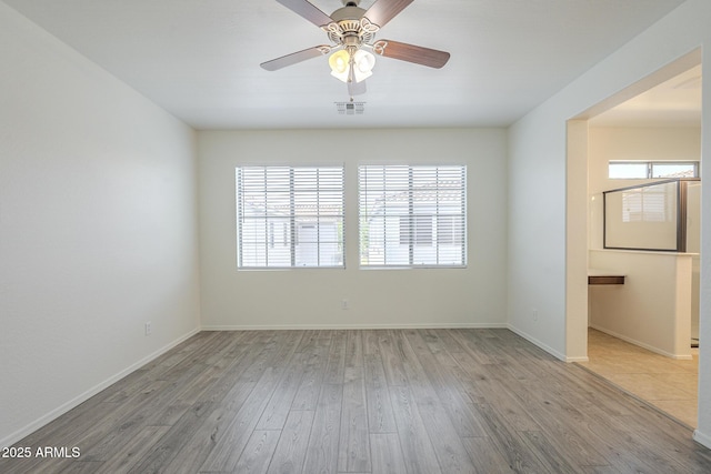 3451 S Wren Dr, Gilbert, AZ 85297 - spare room featuring wood finished floors and ceiling fan