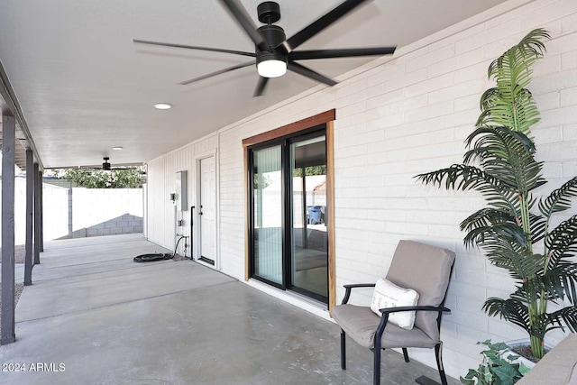 view of patio featuring ceiling fan