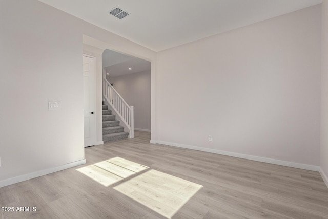 unfurnished room with light hardwood / wood-style floors