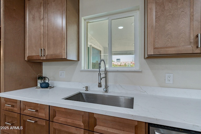 1210 W La Jolla Dr, Tempe, AZ 85282 - kitchen featuring brown cabinetry and light stone counters