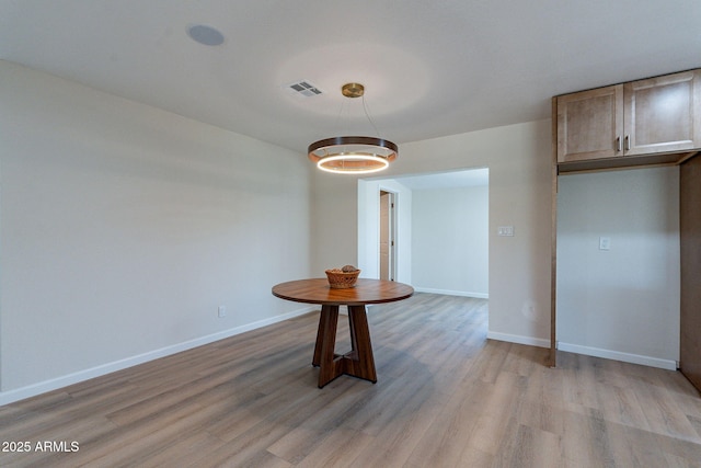 1210 W La Jolla Dr, Tempe, AZ 85282 - unfurnished dining area with light wood-type flooring