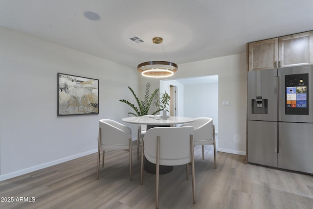 1210 W La Jolla Dr, Tempe, AZ 85282 - dining space featuring light wood-style flooring