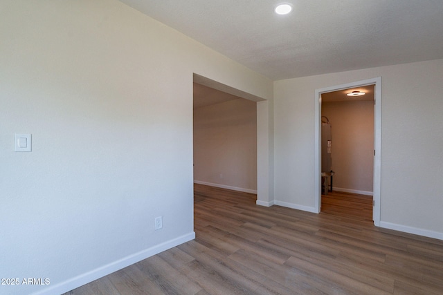 1210 W La Jolla Dr, Tempe, AZ 85282 - empty room featuring wood finished floors and recessed lighting