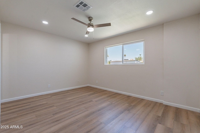 1210 W La Jolla Dr, Tempe, AZ 85282 - unfurnished room with light wood-style floors, ceiling fan, and recessed lighting