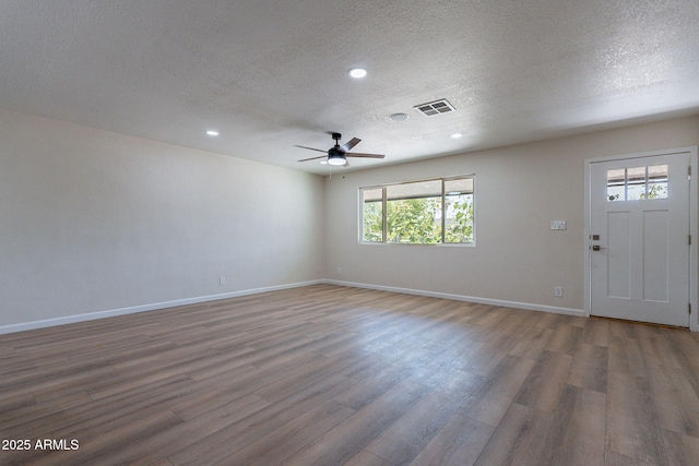 1210 W La Jolla Dr, Tempe, AZ 85282 - unfurnished room featuring a textured ceiling, wood finished floors, ceiling fan, and recessed lighting
