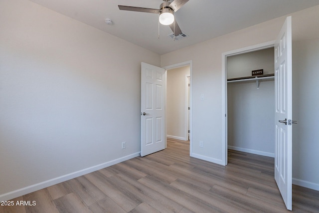 1210 W La Jolla Dr, Tempe, AZ 85282 - unfurnished bedroom with wood finished floors, a closet, and ceiling fan