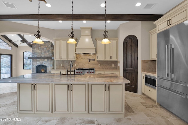 4393 N Twisted Trl, Prescott, AZ 86301 - kitchen featuring cream cabinetry, high end fridge, stove, and custom exhaust hood