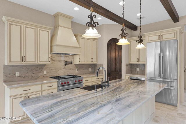 4393 N Twisted Trl, Prescott, AZ 86301 - kitchen with visible vents, cream cabinetry, custom exhaust hood, high end appliances, and a sink