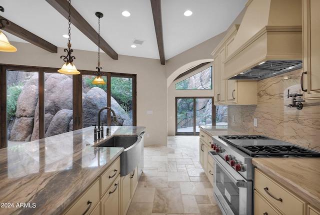 4393 N Twisted Trl, Prescott, AZ 86301 - kitchen featuring stone tile floors, premium range hood, stainless steel range, cream cabinetry, and visible vents