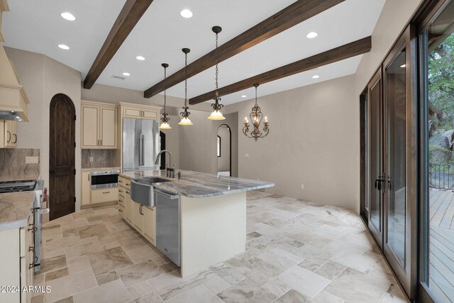 4393 N Twisted Trl, Prescott, AZ 86301 - kitchen with a sink, cream cabinetry, tasteful backsplash, stainless steel appliances, and arched walkways